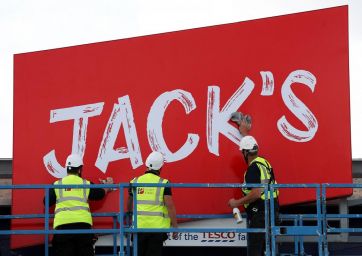 Jack's-Workers unveil the branding at Tesco's new discount supermarket Jack's, in Chatteris-Jack's