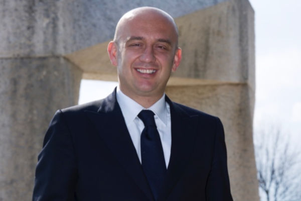 Serafino Cremonini, nuovo Presidente Assocarni. Ritratto sorridente in giacca e cravatta.